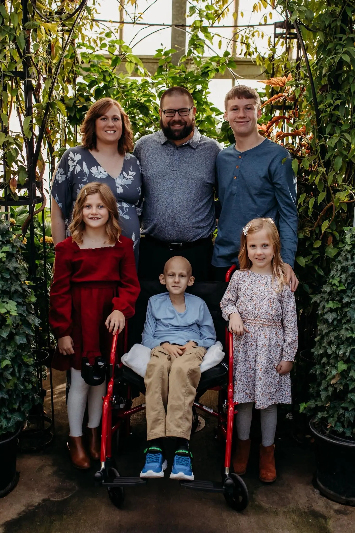 The Springsteen family together in a garden conservatory, with Gavin in the center